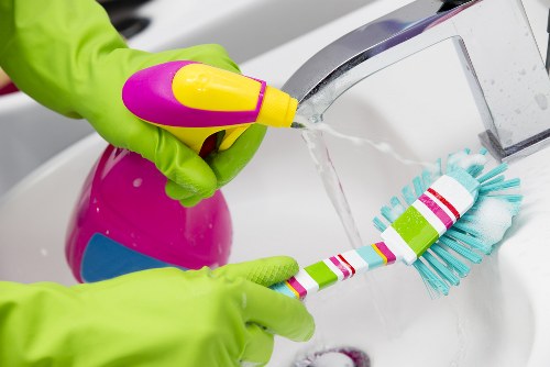 Clean and organised oven cleaning setup with safety supplies